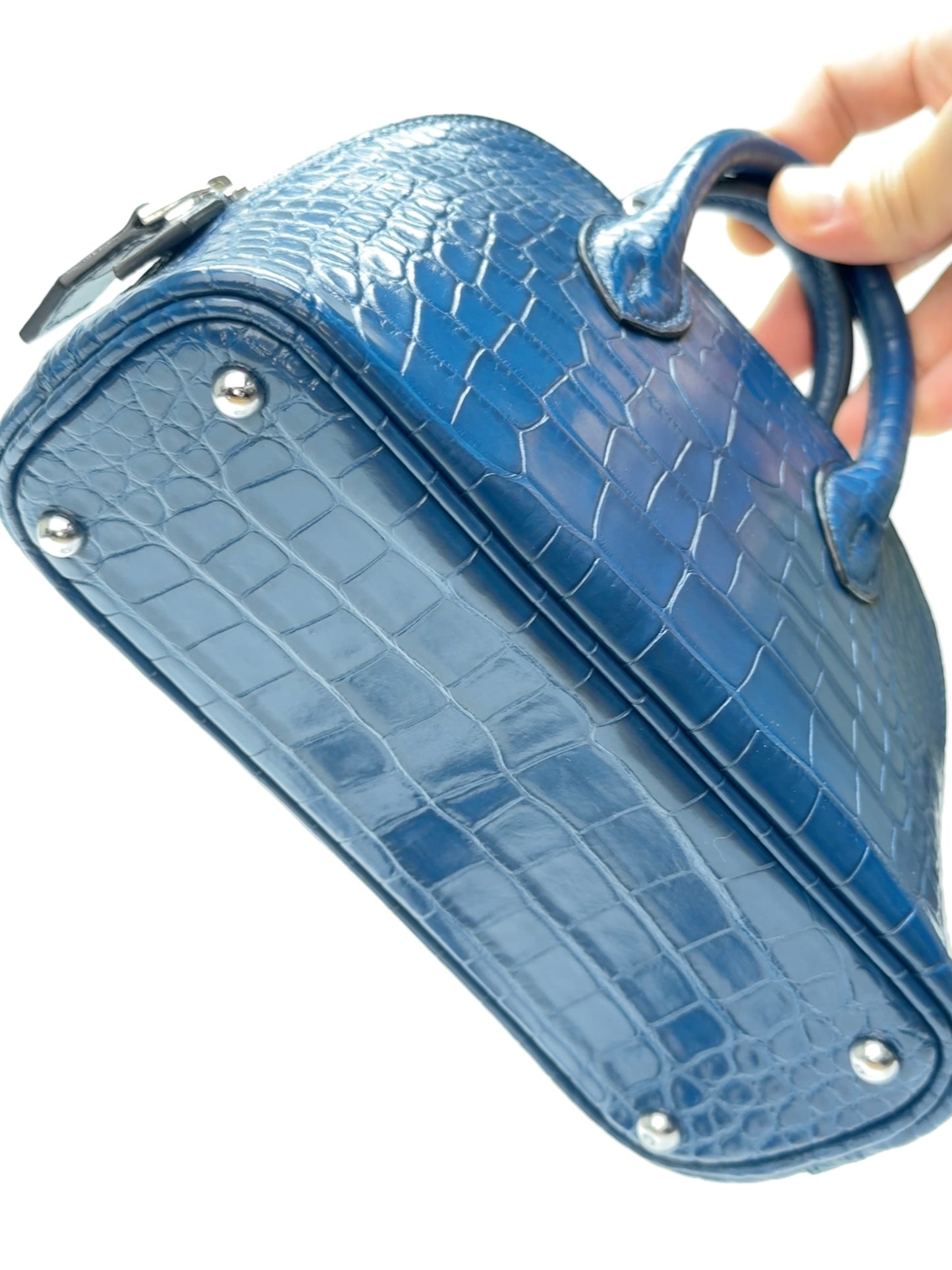 Bottom view of zipper opening on mini dome leather bag