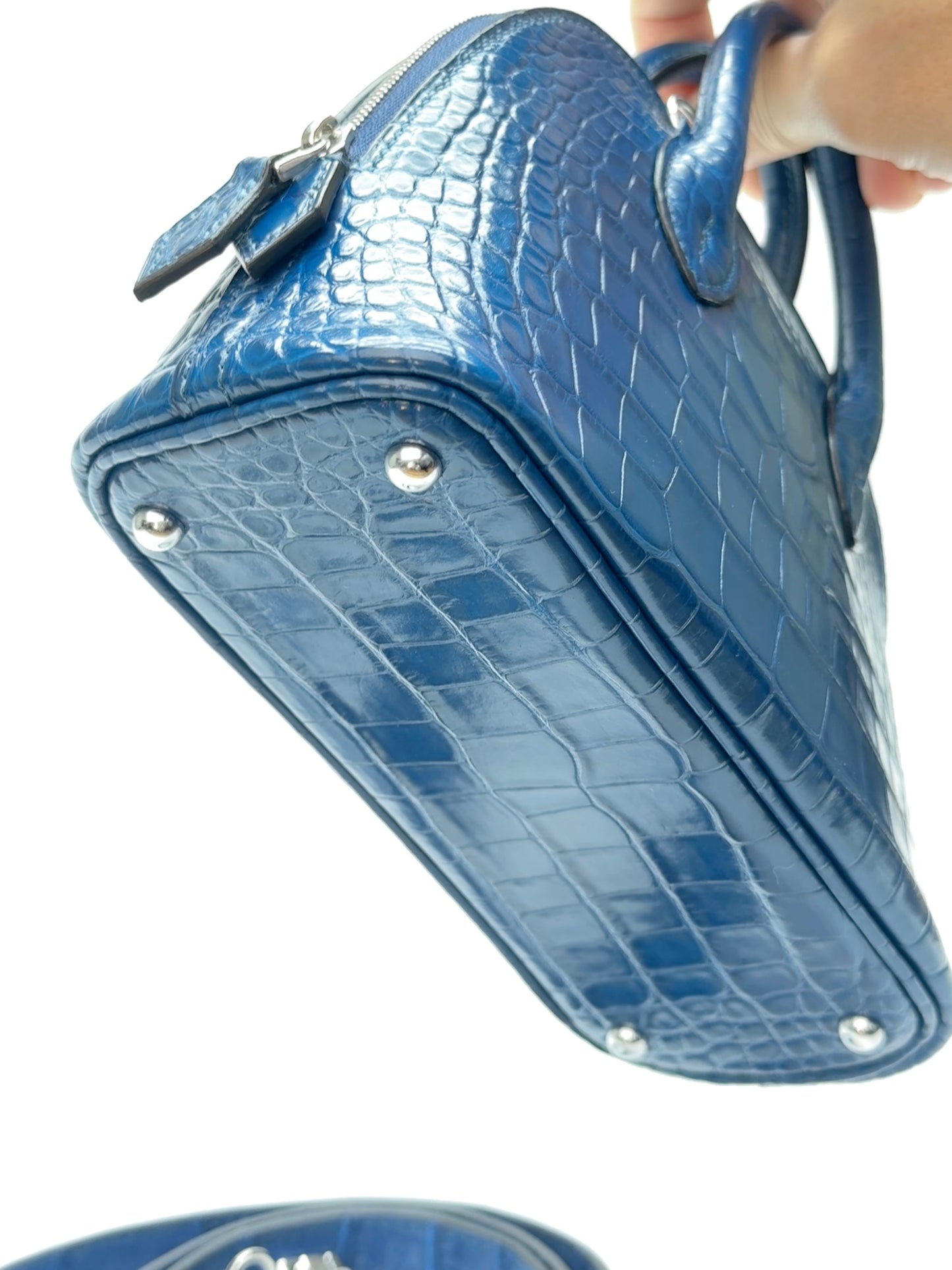Bottom view of zipper opening on mini dome leather bag