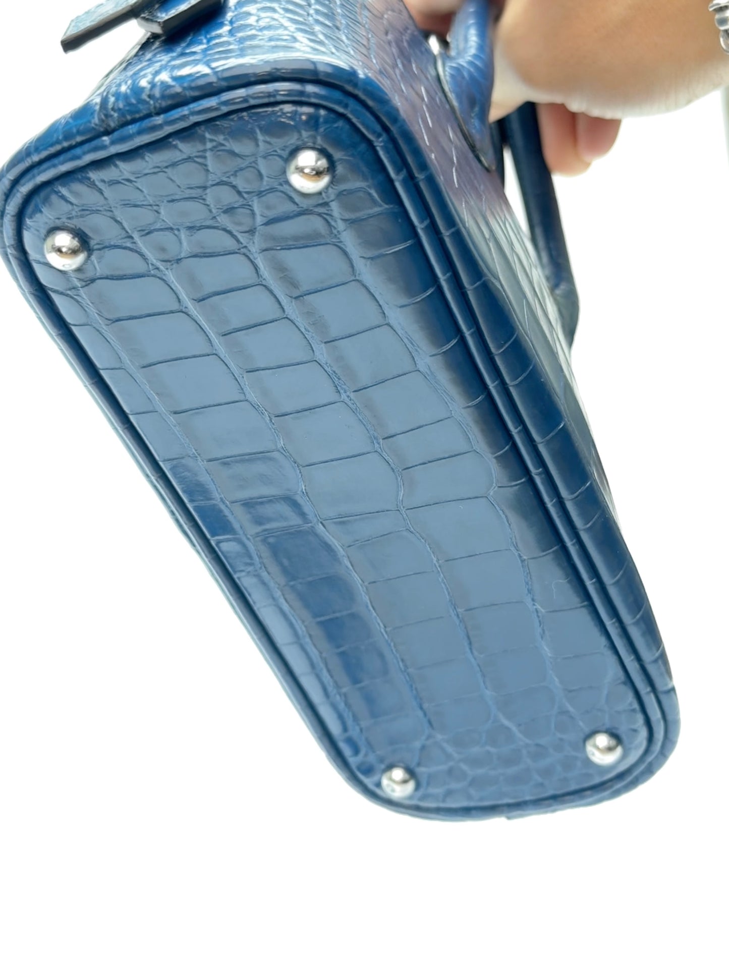 Bottom view of zipper opening on mini dome leather bag