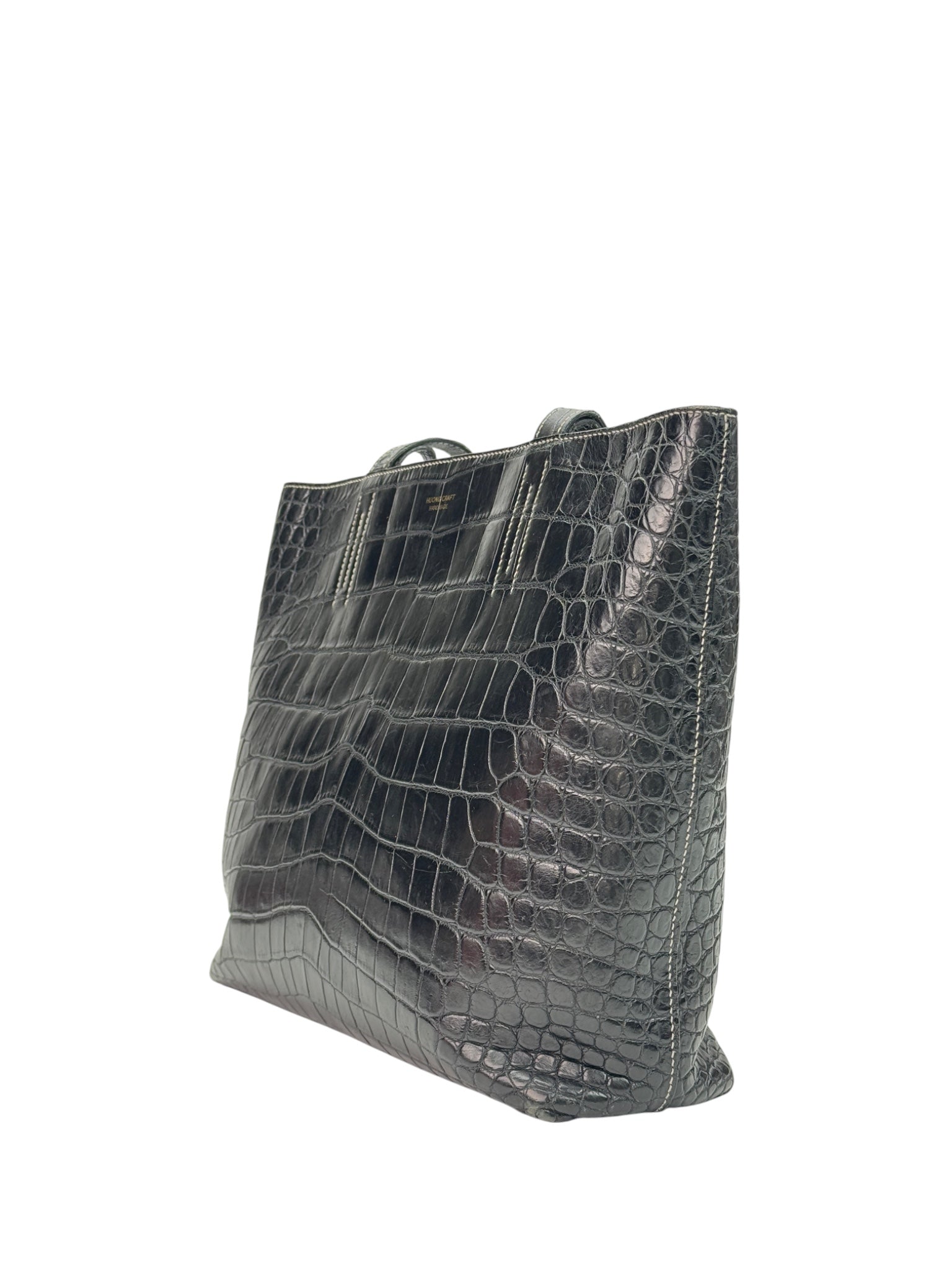 Double-sided leather tote bag side view with folded gussets