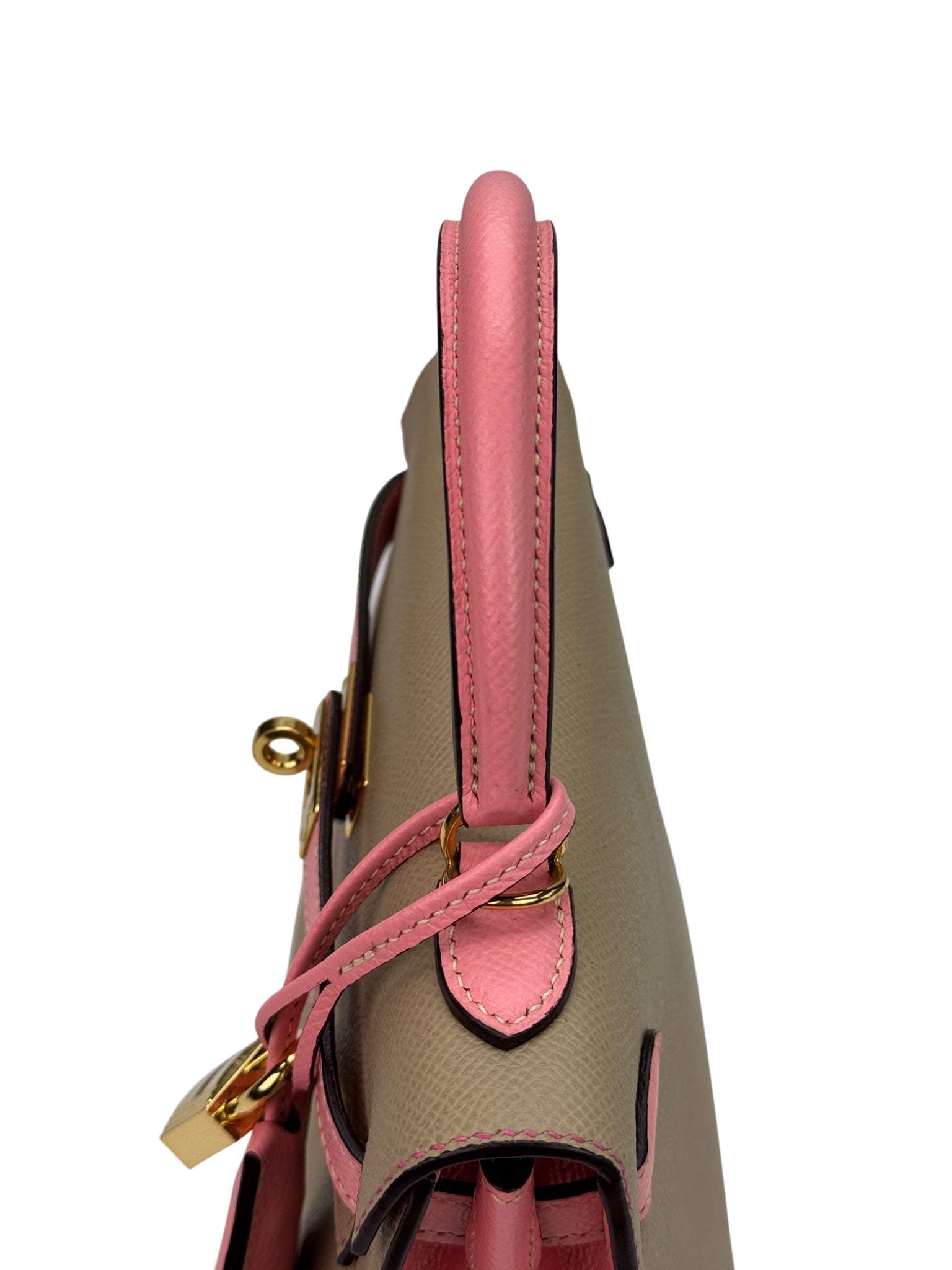 Handle detail of structured top-handle leather bag