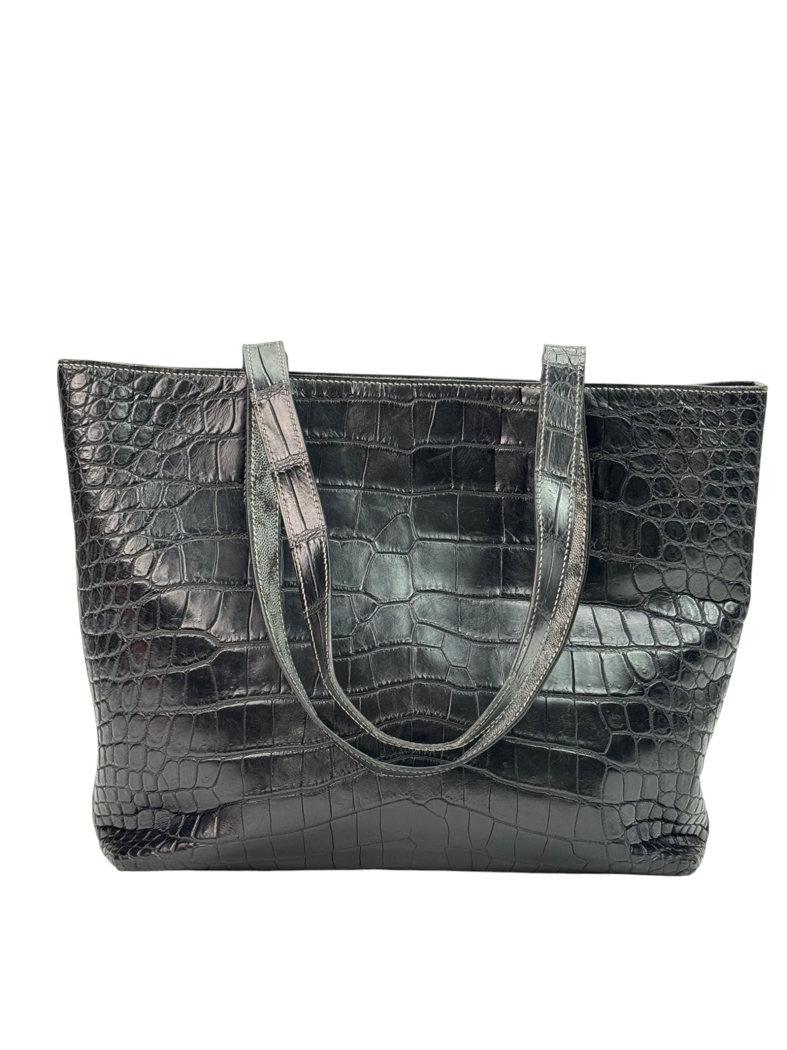 Handmade reversible leather tote showing shoulder handles