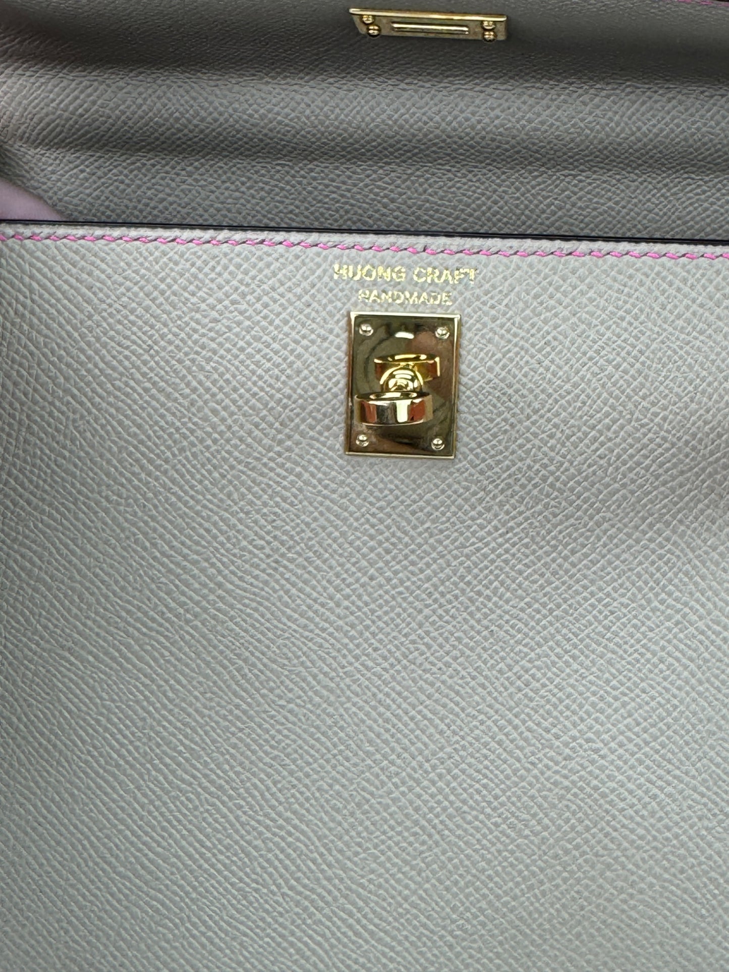 HuongCraft handmade stamp on structured 25 cm trapezoid leather bag