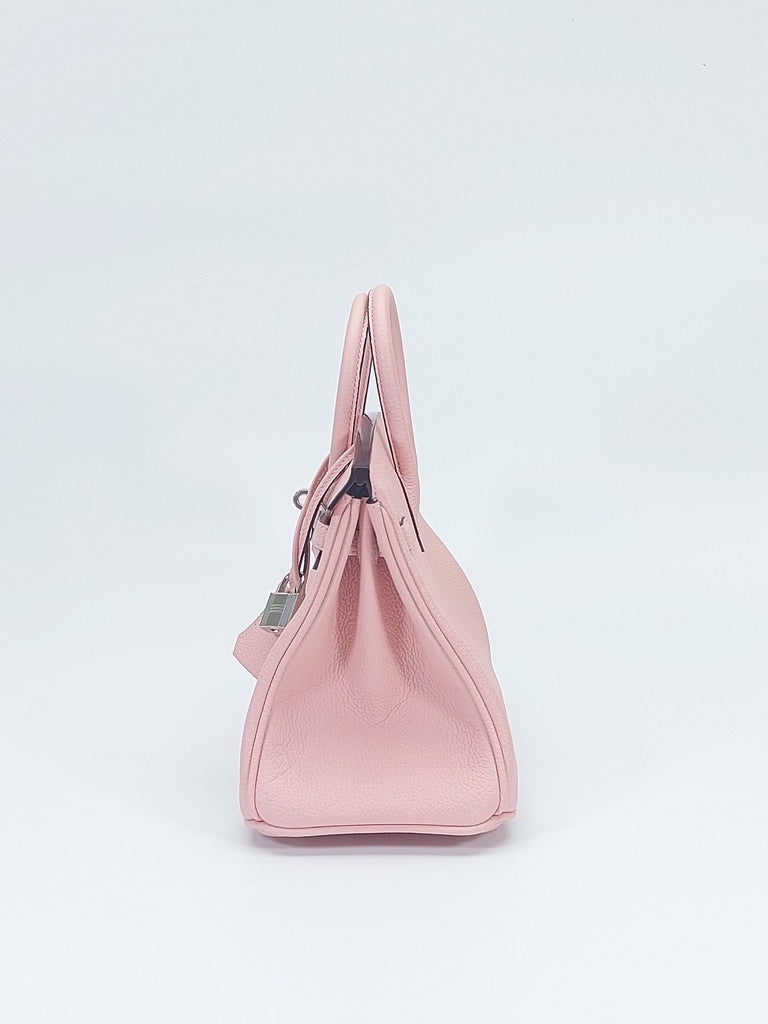 Side gusset detail of structured leather handbag