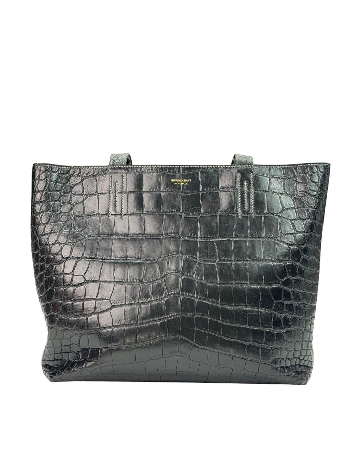 Reversible leather tote bag with open structure and flat base, handmade design