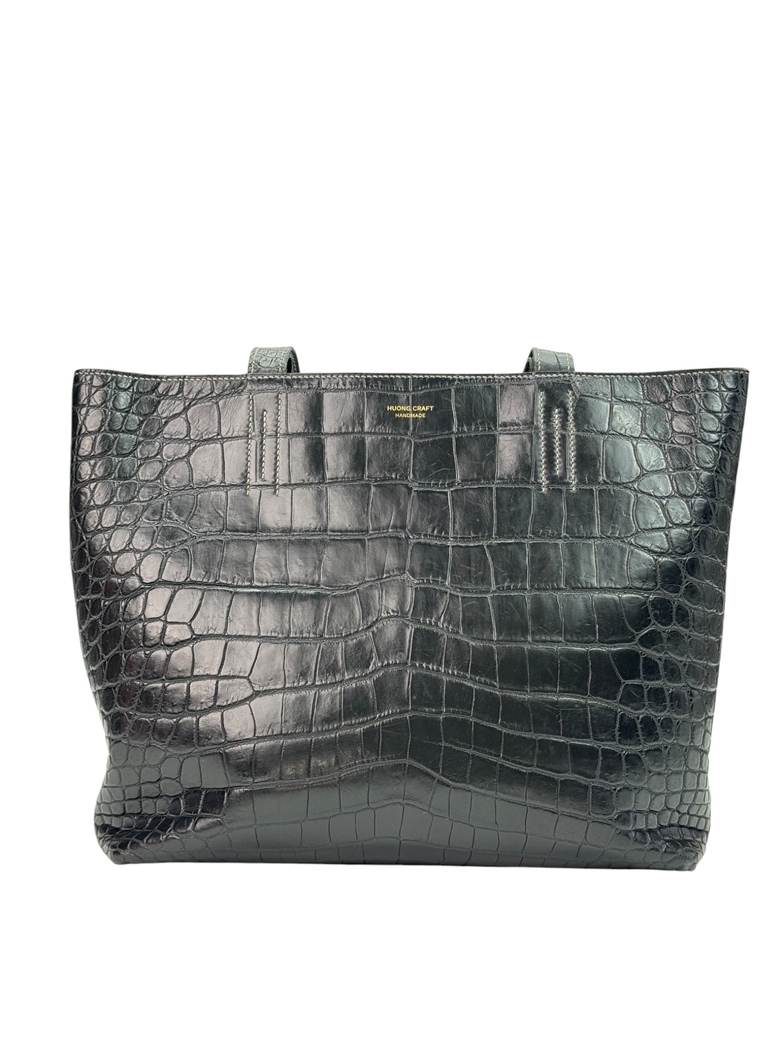 Reversible leather tote bag with open structure and flat base, handmade design